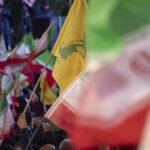 صورة للنائبين حسين الحاج حسن وعلي عمار أو شعار حزب الله