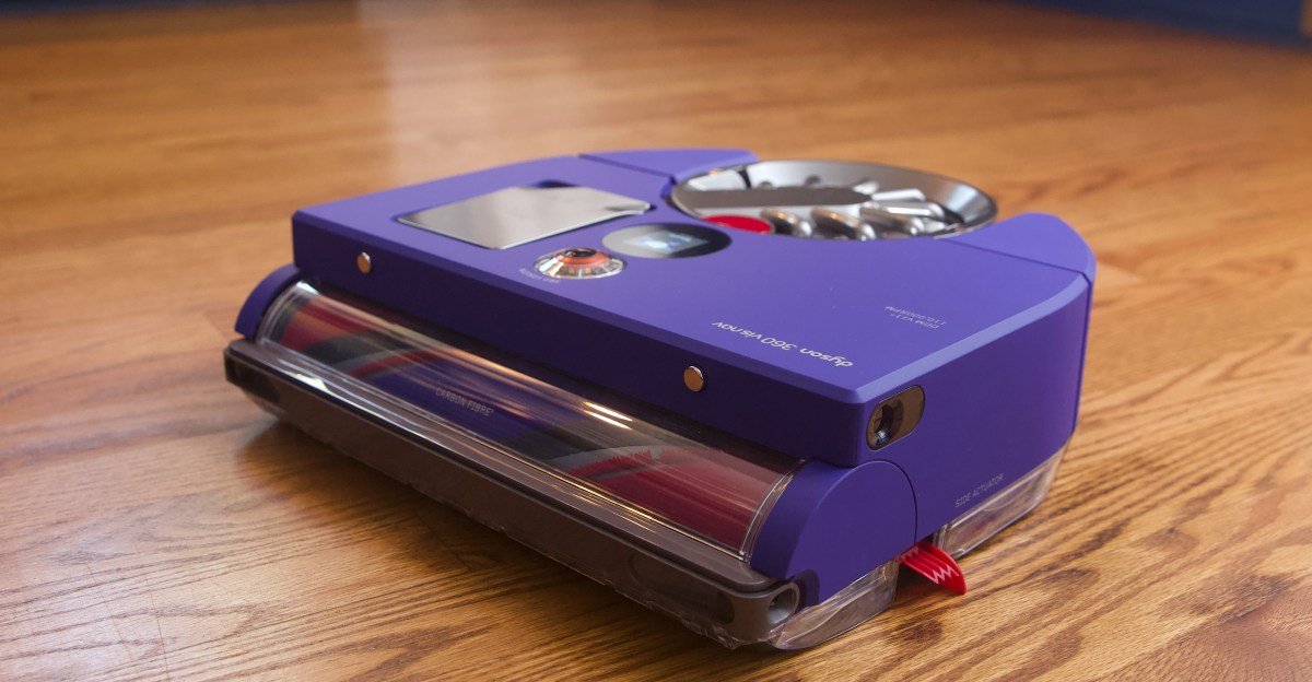 A Dyson 360 Vis Nav robot vacuum cleaning a carpet, showcasing its powerful suction.