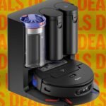 A collection of Dyson vacuum cleaners, including stick vacuums and a robot vacuum, displayed with Memorial Day sale tags.