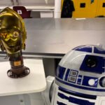 Sam Potozkin's custom-built C-3PO droid head with a shiny gold finish, showcasing intricate details and advanced AI integration.