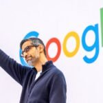 Alphabet CEO Sundar Pichai on stage at Google I/O 2026 keynote, surrounded by futuristic tech visuals.