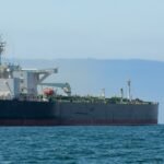 Oil Markets React: Trump's Iran Optimism Sends Prices Plummeting 7% 8 Oil barrels with a backdrop of a global map, symbolizing the impact of Middle East geopolitics on international energy markets.