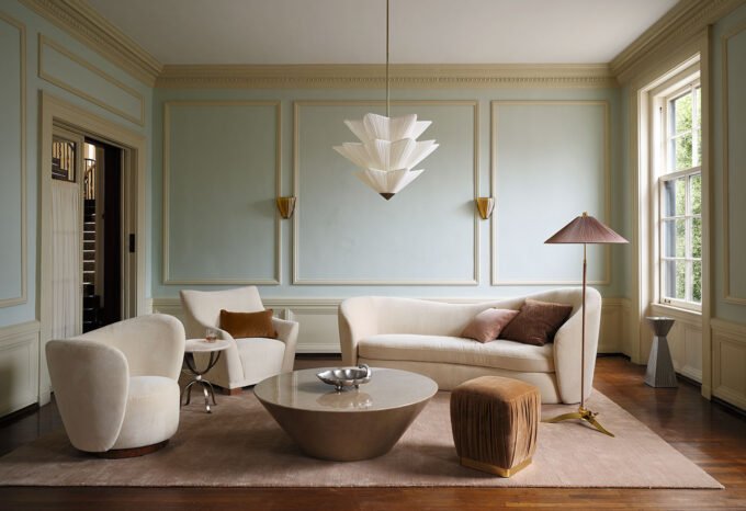 Laura Harrier and Tiffany Howell's cinematic furniture collection for Crate & Barrel, featuring a stylish living room setup.