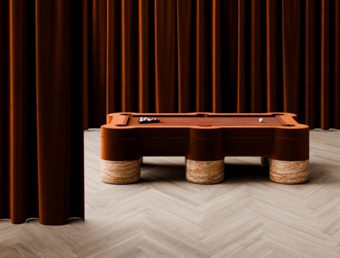 Collection of luxury designer game tables including billiards, ping pong, and foosball, showcasing modern aesthetics.