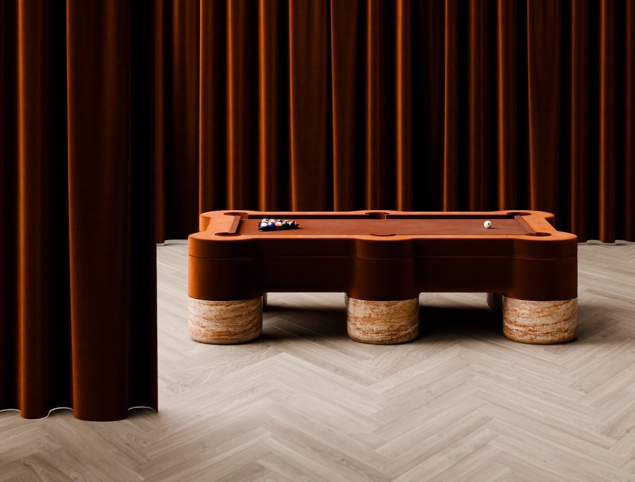 Collection of luxury designer game tables including billiards, ping pong, and foosball, showcasing modern aesthetics.