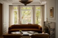Interior view of the renovated Toronto townhouse by Sam Sacks, showing the custom steel and glass bifolding doors.