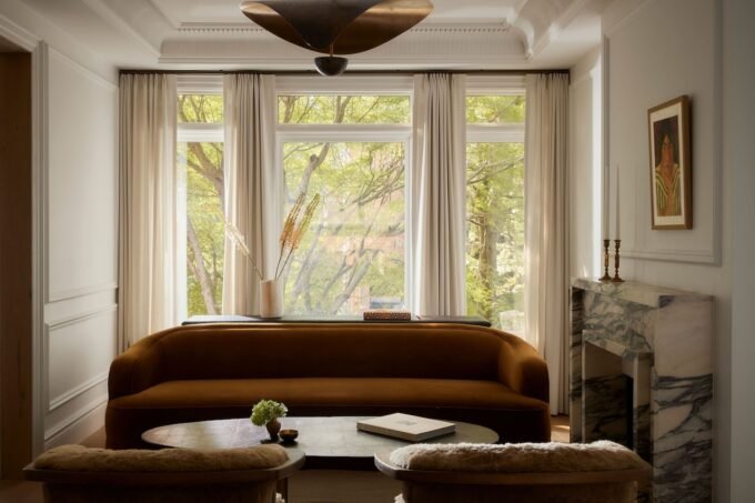 Interior view of the renovated Toronto townhouse by Sam Sacks, showing the custom steel and glass bifolding doors.