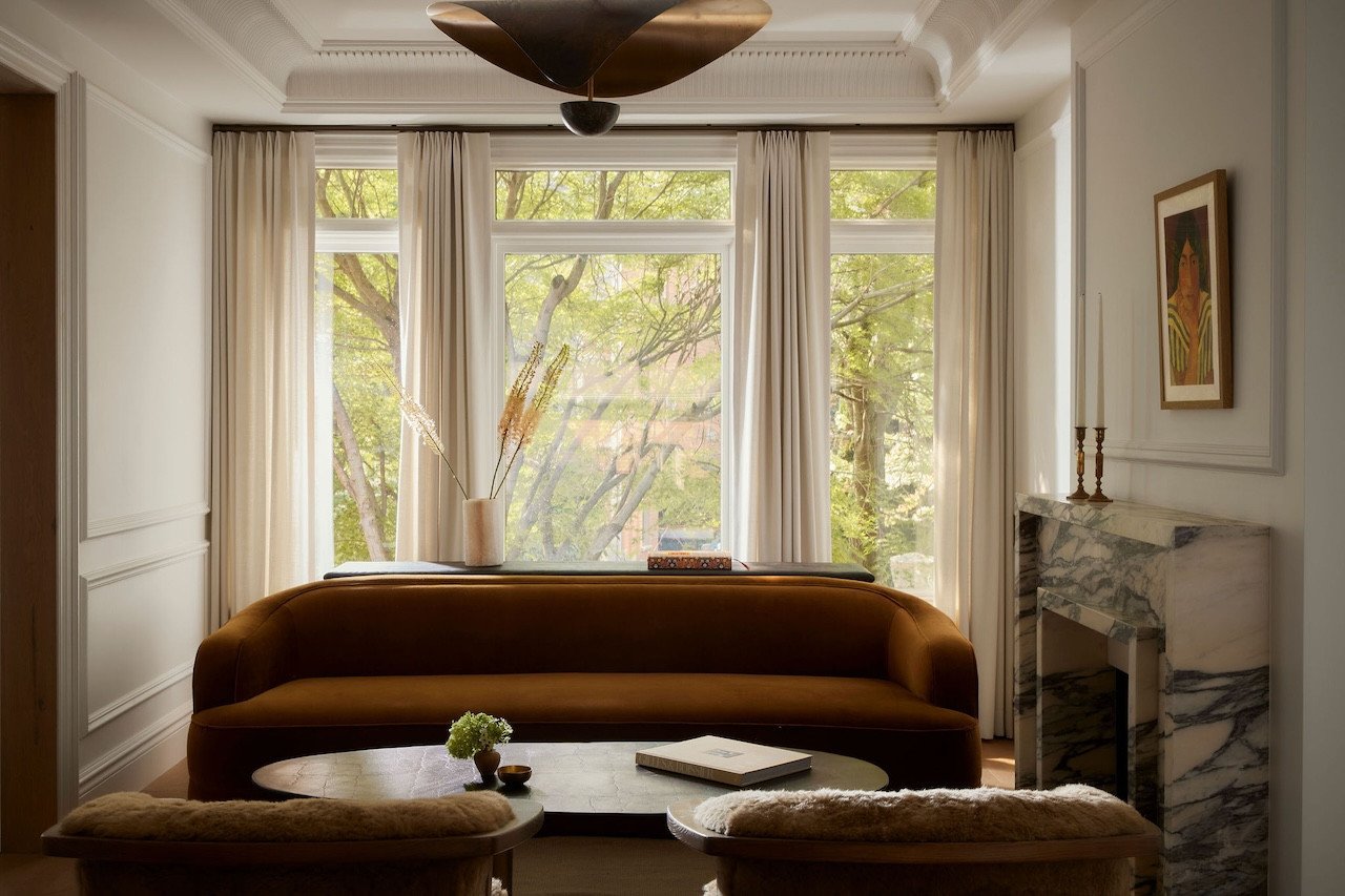 Interior view of the renovated Toronto townhouse by Sam Sacks, showing the custom steel and glass bifolding doors.