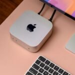 A Mac Mini desktop computer, a compact device, showcasing Apple's design.