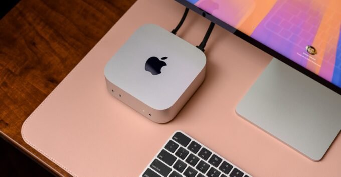 A Mac Mini desktop computer, a compact device, showcasing Apple's design.