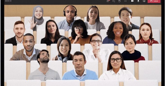 Microsoft Teams Together Mode interface showing multiple participants in a virtual conference room setting.
