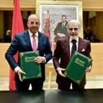 Bank Al-Maghrib Governor Abdellatif Jouahri and Minister Ahmed El Bouari signing a financial education partnership agreement in Rabat.