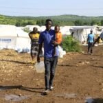 Moyen-Orient : La guerre qui étrangle l'aide aux réfugiés africains, une "préoccupation majeure" pour le HCR 6 Des réfugiés soudanais déplacés, de retour d'Éthiopie, dans un camp du HCR à Gallabat, Soudan, le 11 septembre 2024, illustrant l'urgence humanitaire exacerbée par le conflit au Moyen-Orient.