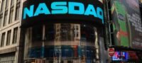 A visual representation of Bitcoin and the Nasdaq stock exchange logo, symbolizing the convergence of traditional finance and cryptocurrency.