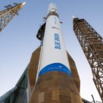 Blue Origin's New Glenn rocket on a launchpad, ready for liftoff.
