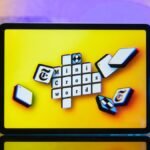 A digital representation of the NYT Mini Crossword grid with the date May 14, 2026, and some solved clues visible.