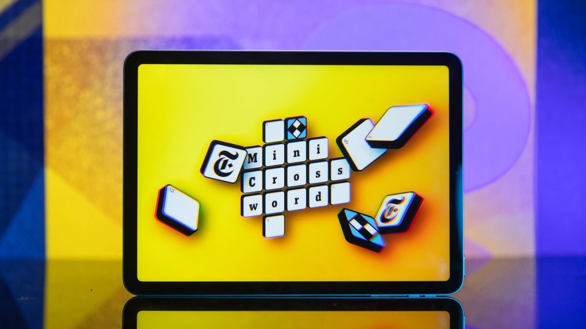 A digital representation of the NYT Mini Crossword grid with the date May 14, 2026, and some solved clues visible.