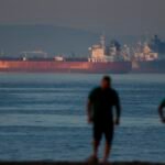 Liberia-flagged crude oil tanker Shenlong Suezmax docked at Mumbai Port after navigating the Strait of Hormuz amidst West Asia conflict.