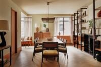 Luxurious interior of the renovated Rockefeller Apartment, showcasing Khaya mahogany and Portoro marble accents.