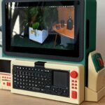A vibrant, custom-built cyberdeck made from salvaged electronics, showcasing a unique, retro-futuristic design.