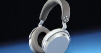 Sennheiser Momentum 5 Wireless headphones in black, white, and denim blue, showcasing their sleek, contemporary design.