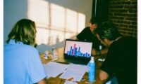 A diverse group of small business owners reviewing insurance documents with a professional advisor, highlighting tailored coverage.