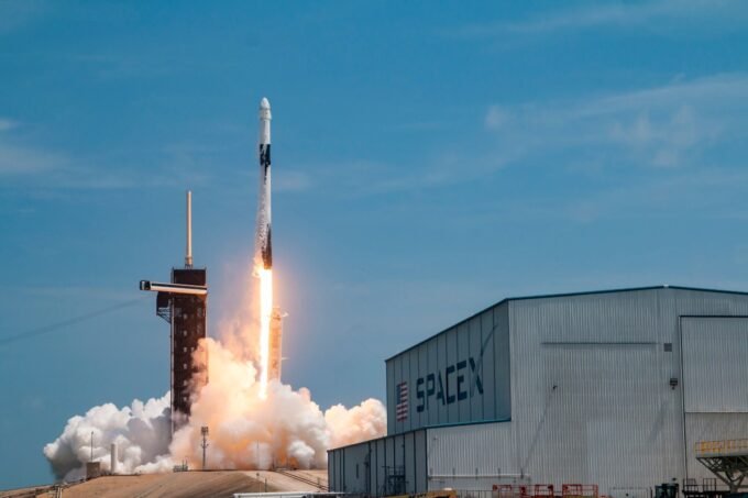 SpaceX Falcon 9 rocket launching, symbolizing the company's advanced space technology and government partnerships.