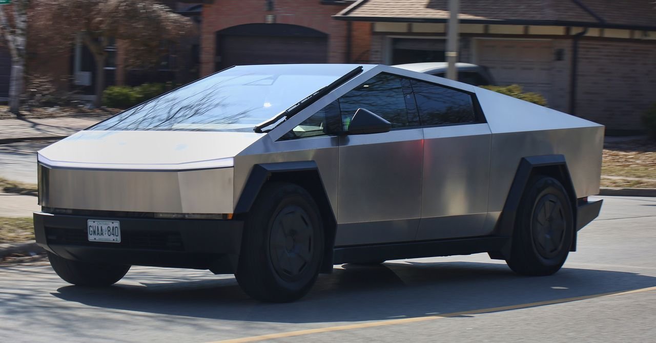 A Tesla Cybertruck on a road with one of its wheels highlighted, symbolizing the recall issue.