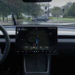 Tesla's Full Self-Driving Suite Arrives in China: A Game Changer? 6 Tesla vehicle displaying Full Self-Driving (FSD) interface on its central screen, with a cityscape of China in the background.