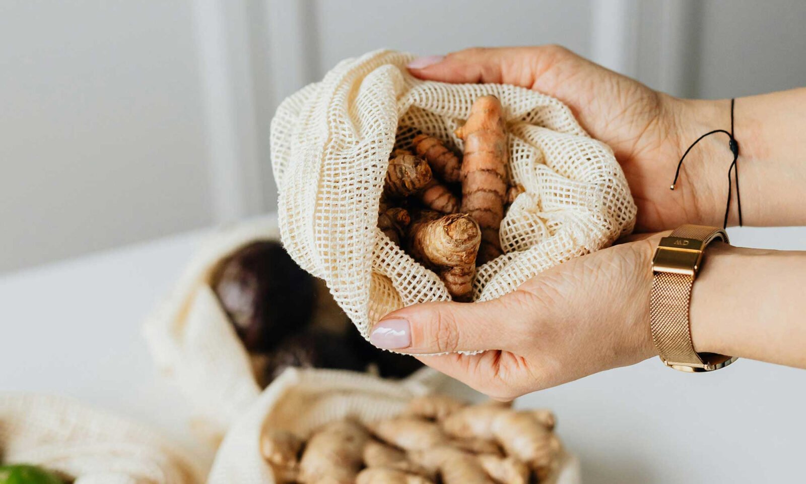 Golden turmeric powder and fresh turmeric root, symbolizing natural blood sugar control.