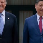 US and Chinese flags with agricultural products, symbolizing a new trade agreement