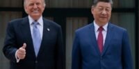 US and Chinese flags with agricultural products, symbolizing a new trade agreement