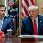 U.S. President Donald Trump speaks next to Secretary of State Marco Rubio during a cabinet meeting at the White House.