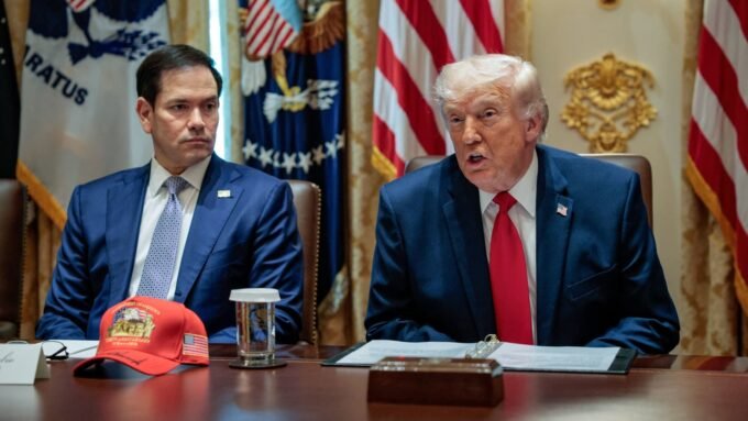 U.S. President Donald Trump speaks next to Secretary of State Marco Rubio during a cabinet meeting at the White House.