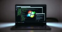 Illustration of a lock being bypassed or a computer screen with security warnings, symbolizing Windows zero-day vulnerabilities.