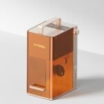 xTool F2 portable dual-laser engraver in action, engraving a material.