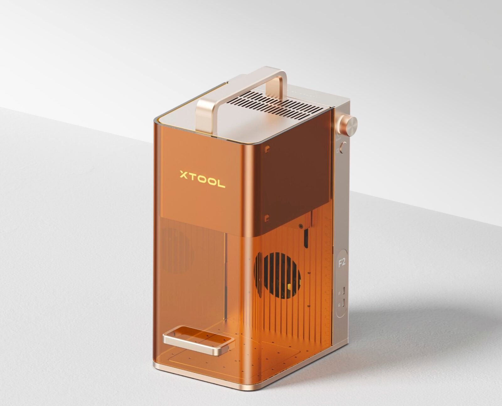 xTool F2 portable dual-laser engraver in action, engraving a material.