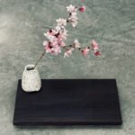 A finished Yakisugi display stand showcasing charred cedar wood grain