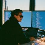 An entrepreneur contemplating the strategic use of AI to maintain a competitive edge.