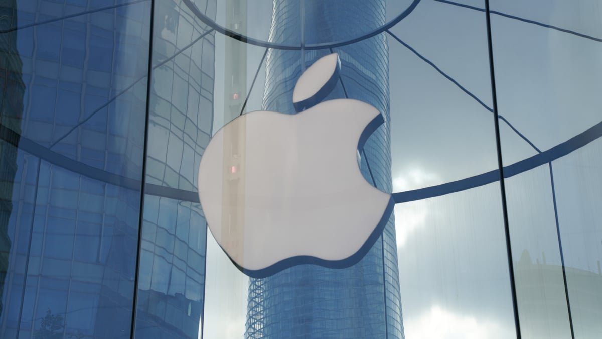 A pair of sleek, futuristic smart glasses with an Apple logo, symbolizing the delayed augmented reality device.