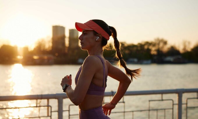 A runner's legs in motion, emphasizing the importance of proper nutrition for athletic performance and injury prevention.