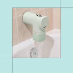 Canopy Bath Tub Filter attached to a faucet, filtering water for a cleaner bath experience.