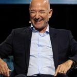 Jeff Bezos speaking at a conference, illustrating his advice on stress and action.