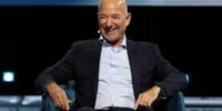 Jeff Bezos speaking at a conference, illustrating his advice on stress and action.