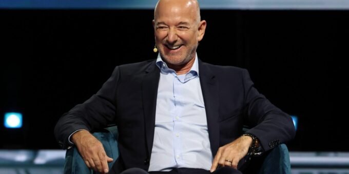 Jeff Bezos speaking at a conference, illustrating his advice on stress and action.
