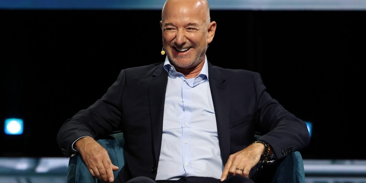 Jeff Bezos speaking at a conference, illustrating his advice on stress and action.