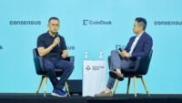 Changpeng Zhao (CZ) speaking at a cryptocurrency event, symbolizing his influence in the industry.
