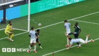 لقطة من مباراة المنتخب السعودي أمام الأوروغواي في كأس العالم 2026، ولقطة لمدافع المنتخب المصري يحاول قطع الكرة من لوكاكو في مباراة بلجيكا.