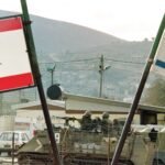صورة توضيحية لخرائط إسرائيل ولبنان مع رموز للسلام والمفاوضات