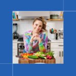 Melissa Ben-Ishay smiling in a kitchen, holding a plate of a freshly prepared, simple weeknight meal.